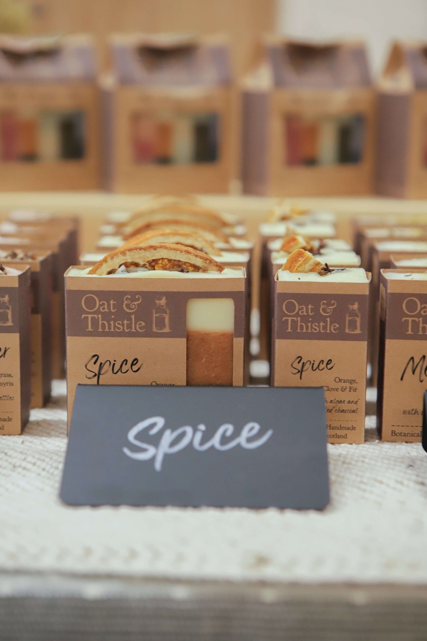 Spice soap in packaging on market table