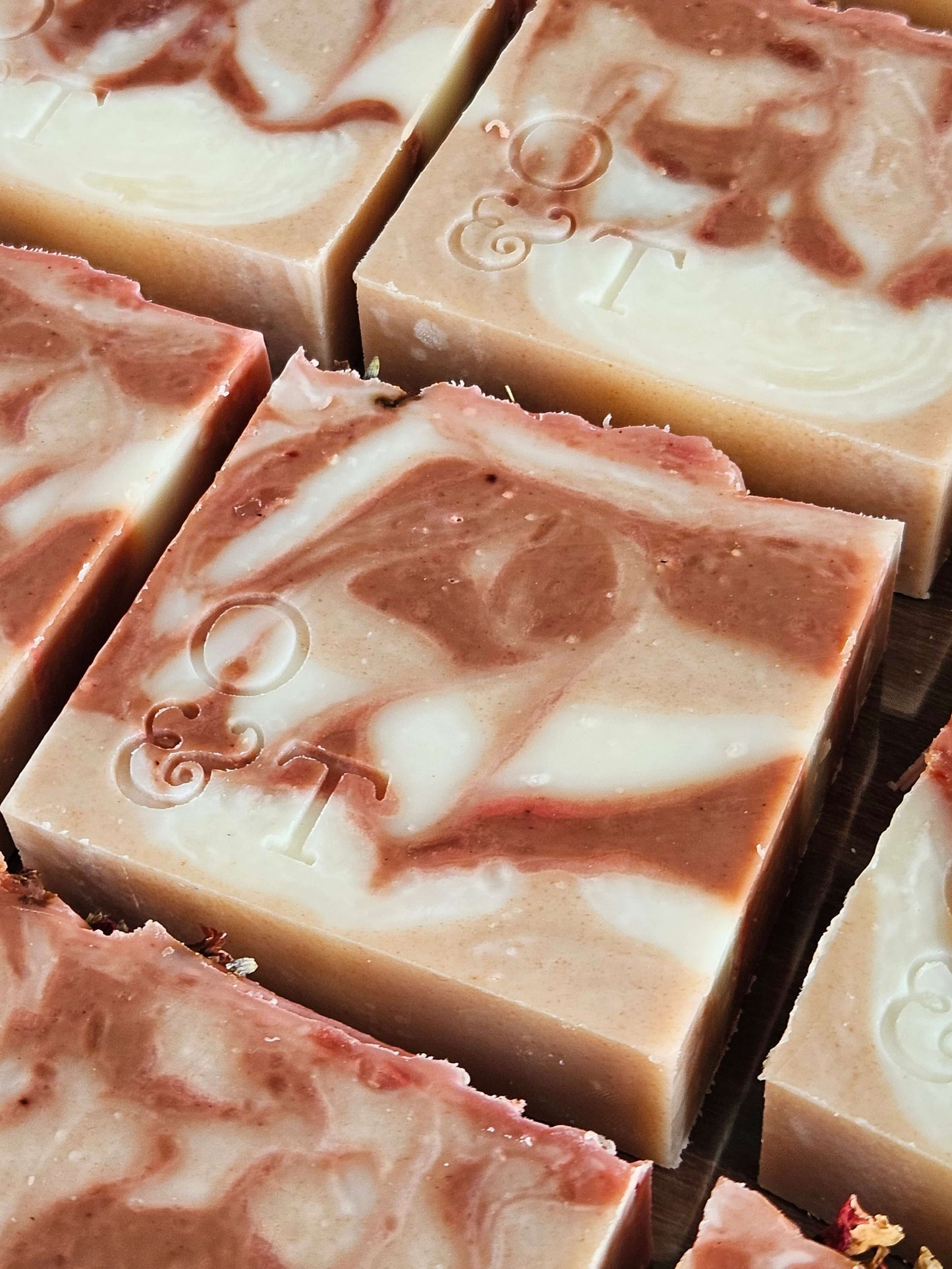 Large close up of flora soap bars with stamped logo