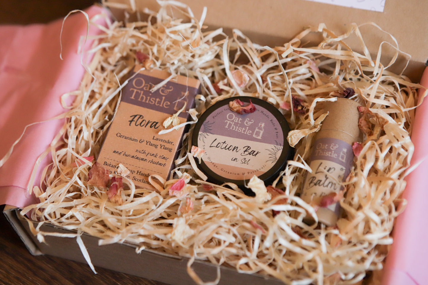 seasonal apothecary gift box, soap lotion bar and lip balm nestled in wood wool gift box